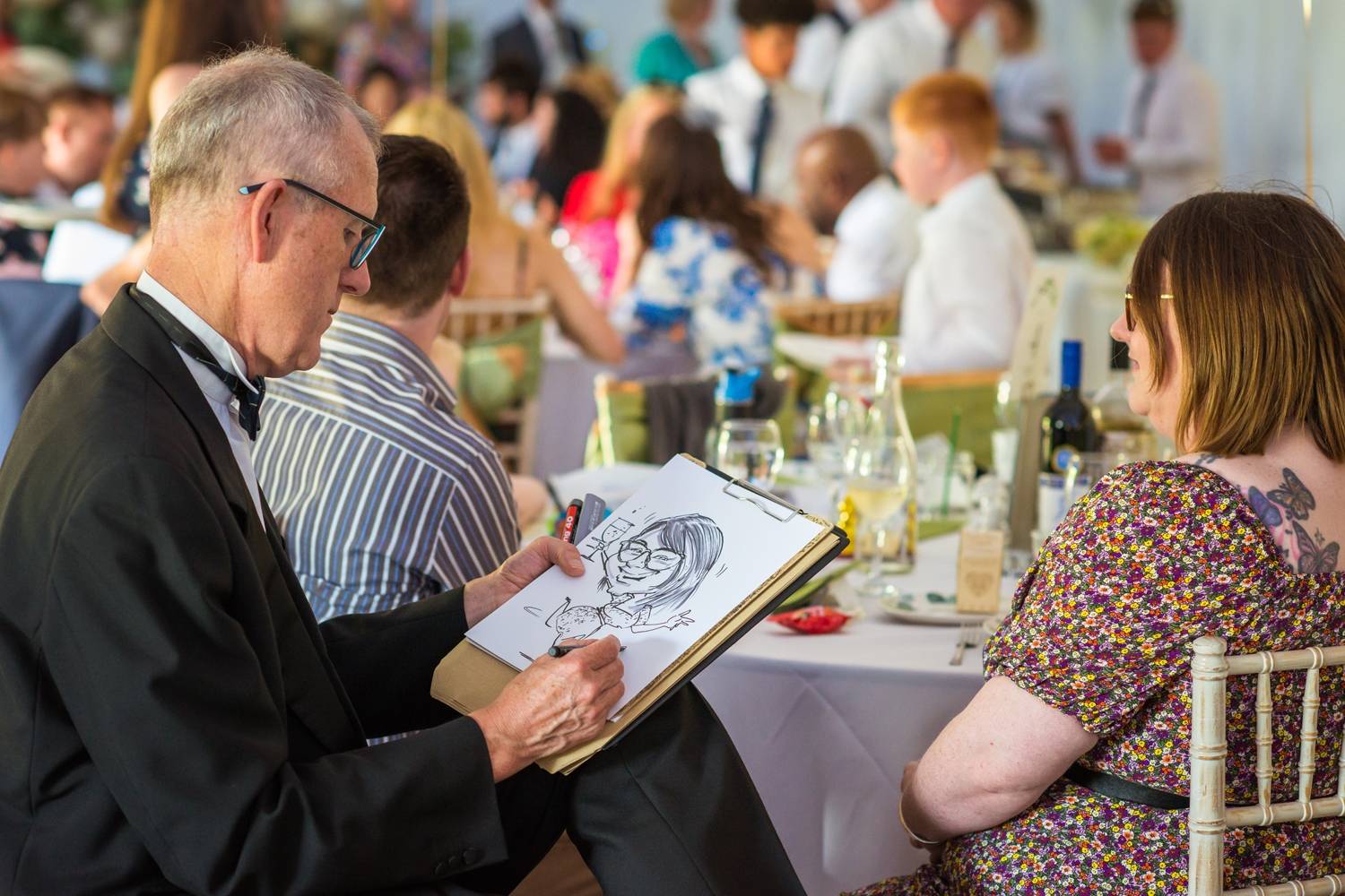 Caricaturing the Bride and Groom at their wedding